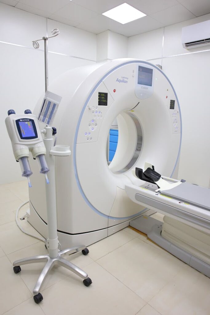 Bright hospital room featuring a modern MRI machine and related technology.